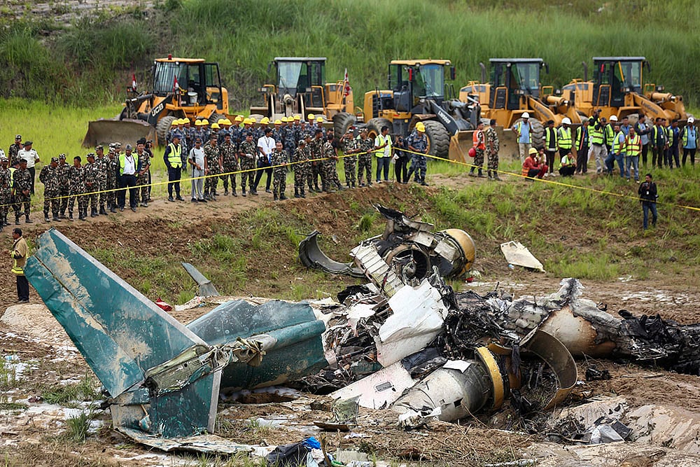 | Photo: AP/Sujan Gurung : Plane carrying 19 people crashes in Nepal